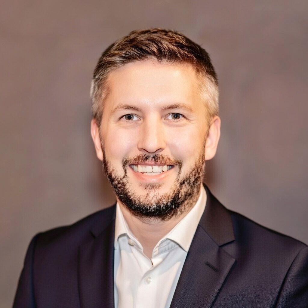 Professional headshot of Nate Burgess